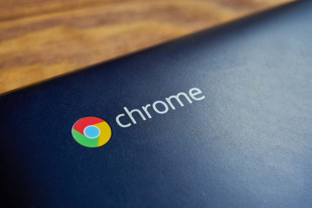 A Chromebook for Education on a wooden desk.