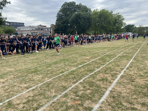 Students are seen running in lanes for a race on Sports Day.