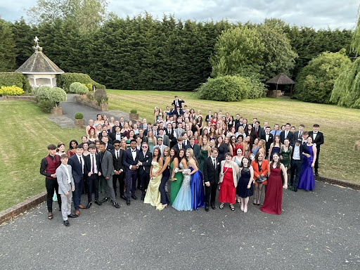 A group of Year 11 students are pictured in their dresses and suits for the Year 11 Prom.