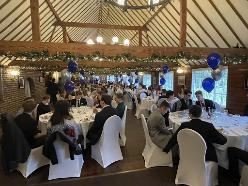 A large group of Year 11 students are pictured sat down for a meal at their Year 11 Prom.