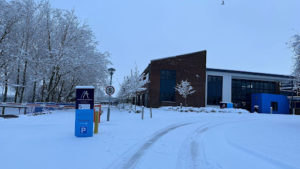 An external photo of the Mascalls Academy building covered in snow in December 2022.