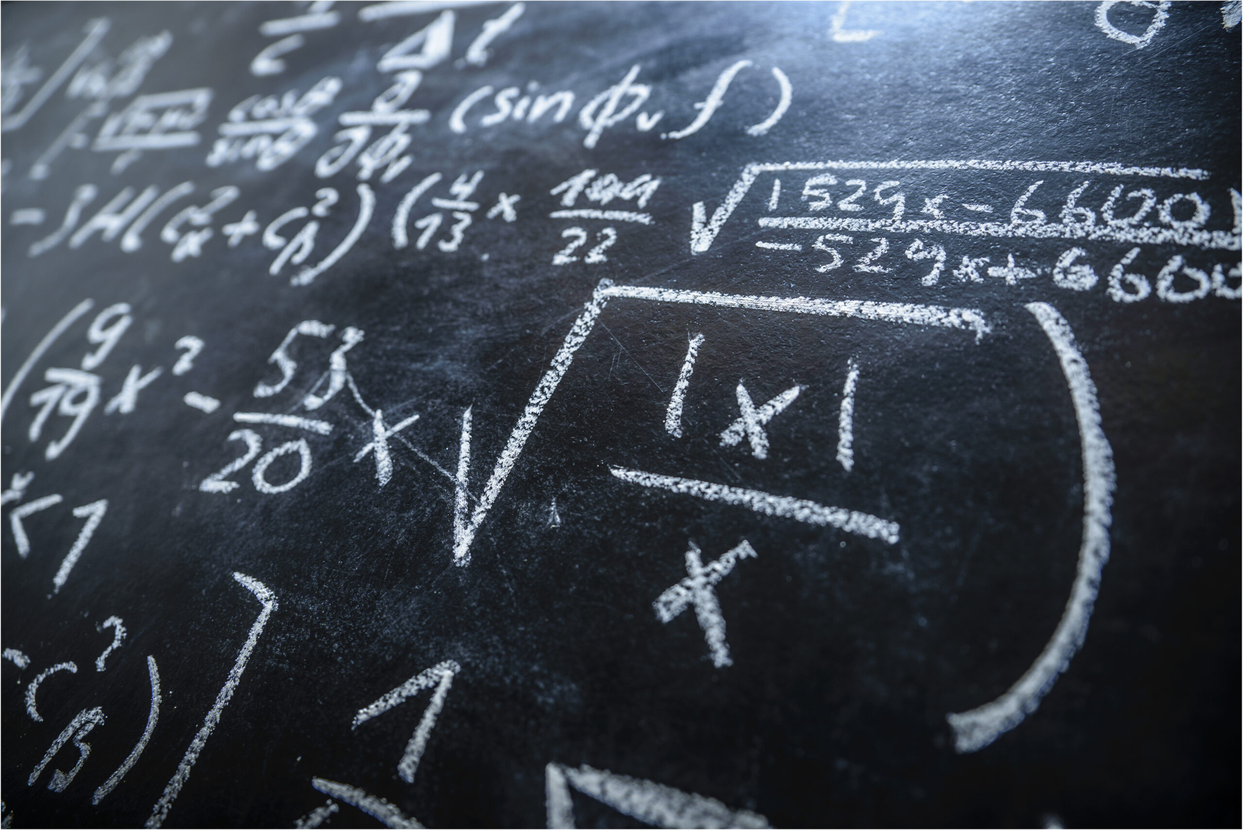 A blackboard filled with formulas and equations